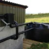 Rainwater Harvesting Kit installed on the side of a barn